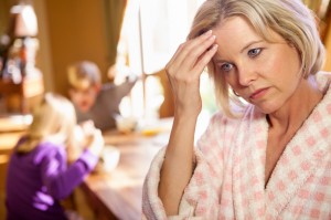 Overwhelmed mother with fighting kids
